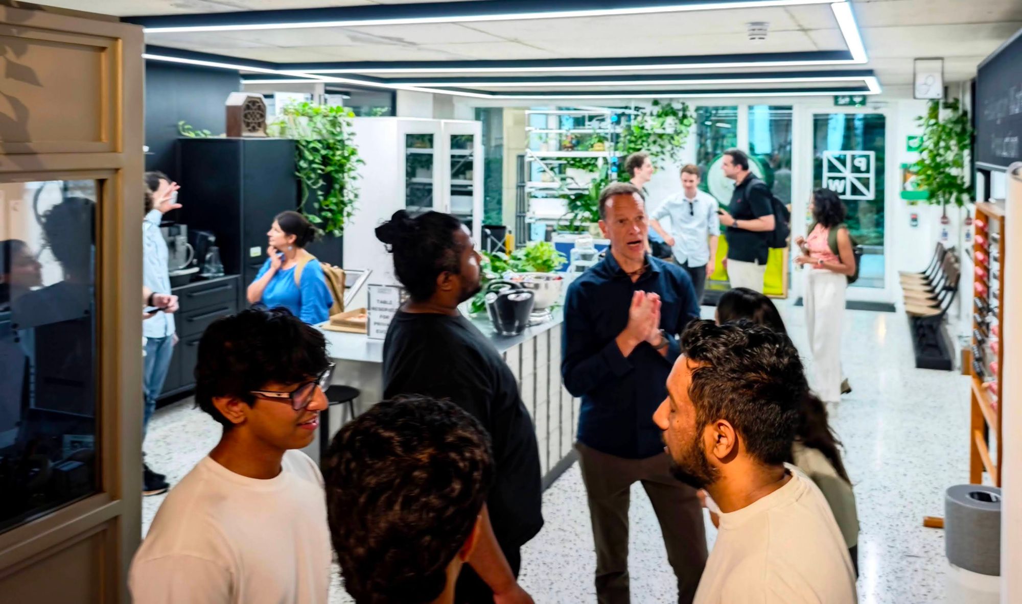 People deep in conversation at a community meetup